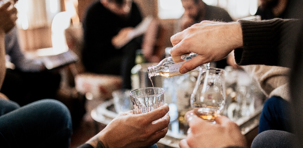 A group of people tasting japanese whisky concept of fine alcohol master class and degustation of whisky jpg